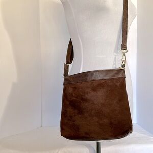 Malibu Skye brown faux side cross. Body purse like new w:leopard print interior